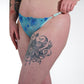 Person wearing a blue lingerie with a white background