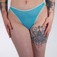 Person wearing blue lingerie bottom on a plain background